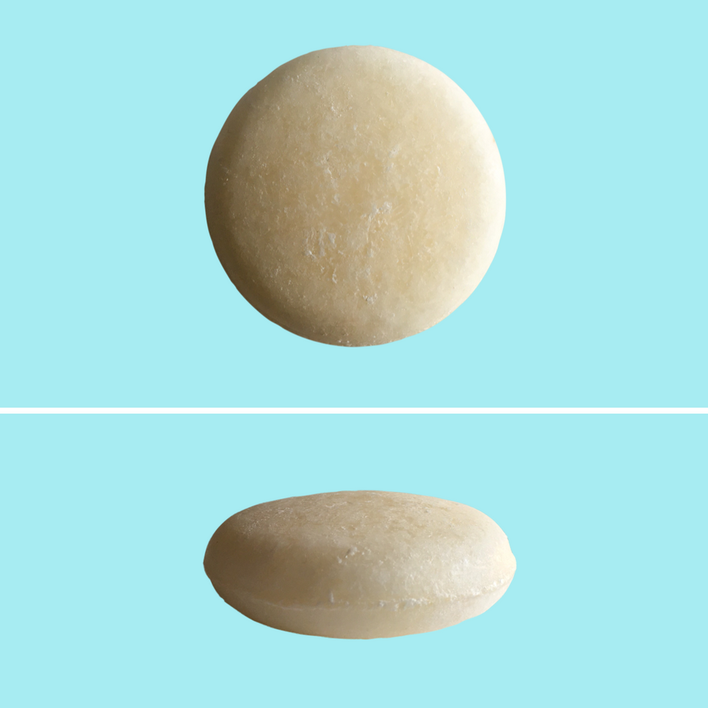 Top and side view of Green Ablutions Purifying Peppermint Shampoo Bar on blue background. Sustainable Zero-waste Plastic-free haircare.